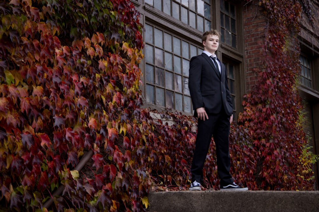 High School Senior guy in a suit for his senior pictures.