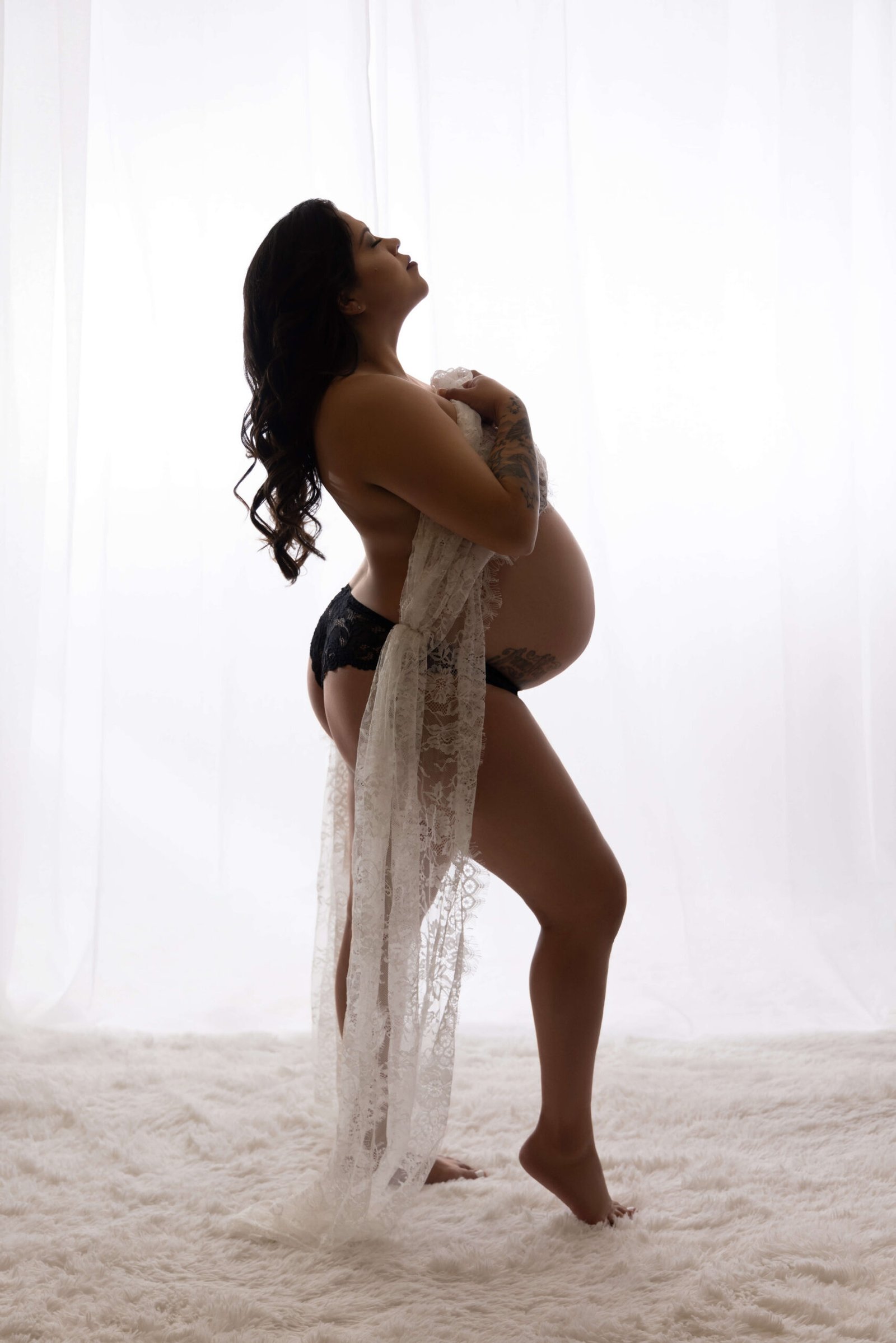 Pregnant woman in silhouette pose.